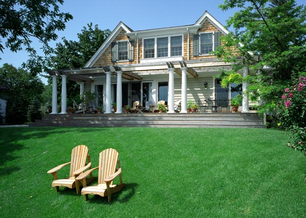 Hudson Septic Tank Cleaning | Rock Hill, York County, Chester County, Lancaster County | beautiful home with manicured lawn with two wooden lounge chairs